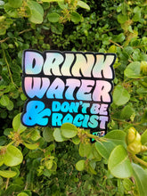 Load image into Gallery viewer, Holographic Drink Water &amp; Don’t Be Racist AOC Sticker
