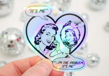 Load image into Gallery viewer, It’s me, hi, I’m the problem it’s me Retro Holographic Sticker
