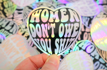 Load image into Gallery viewer, Holographic Women Don’t Owe You Sh. Sticker
